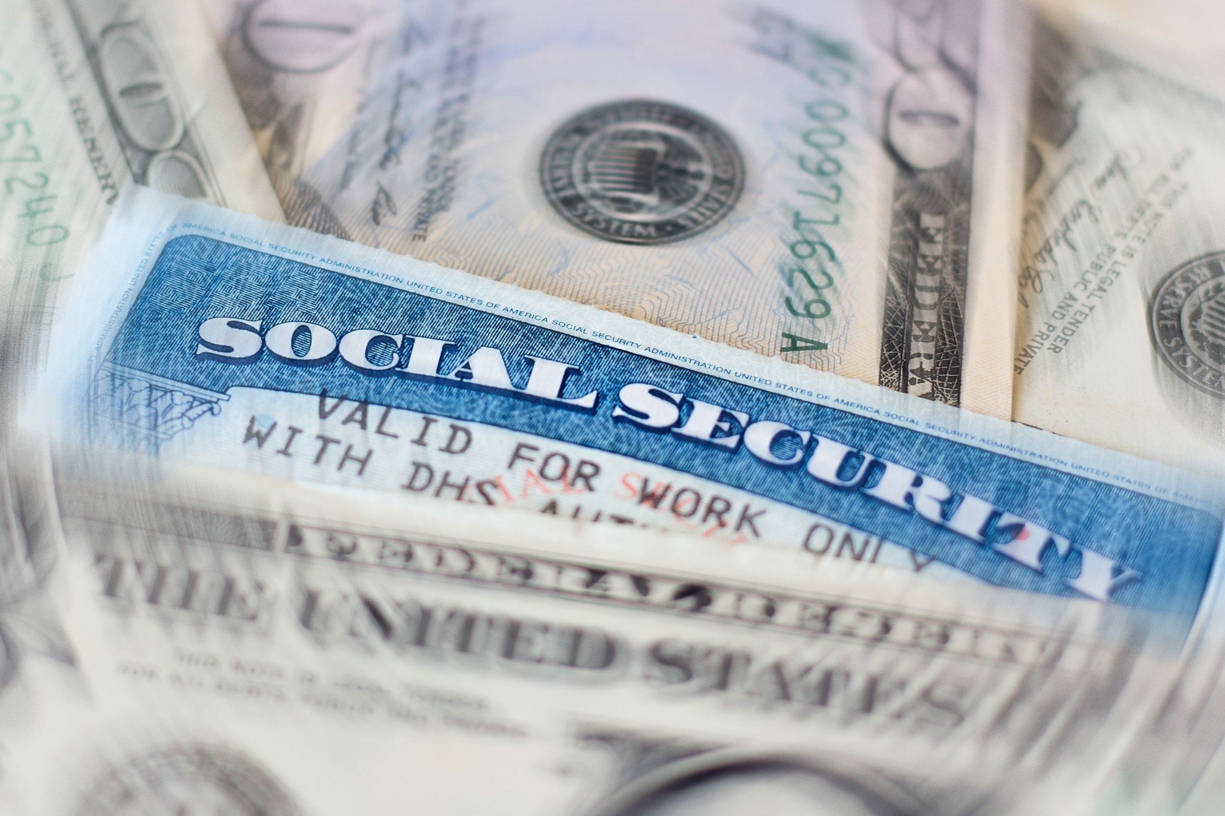 Social security card amongst cash.