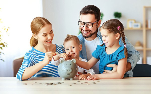 Parents teaching their kids about financial literacy.