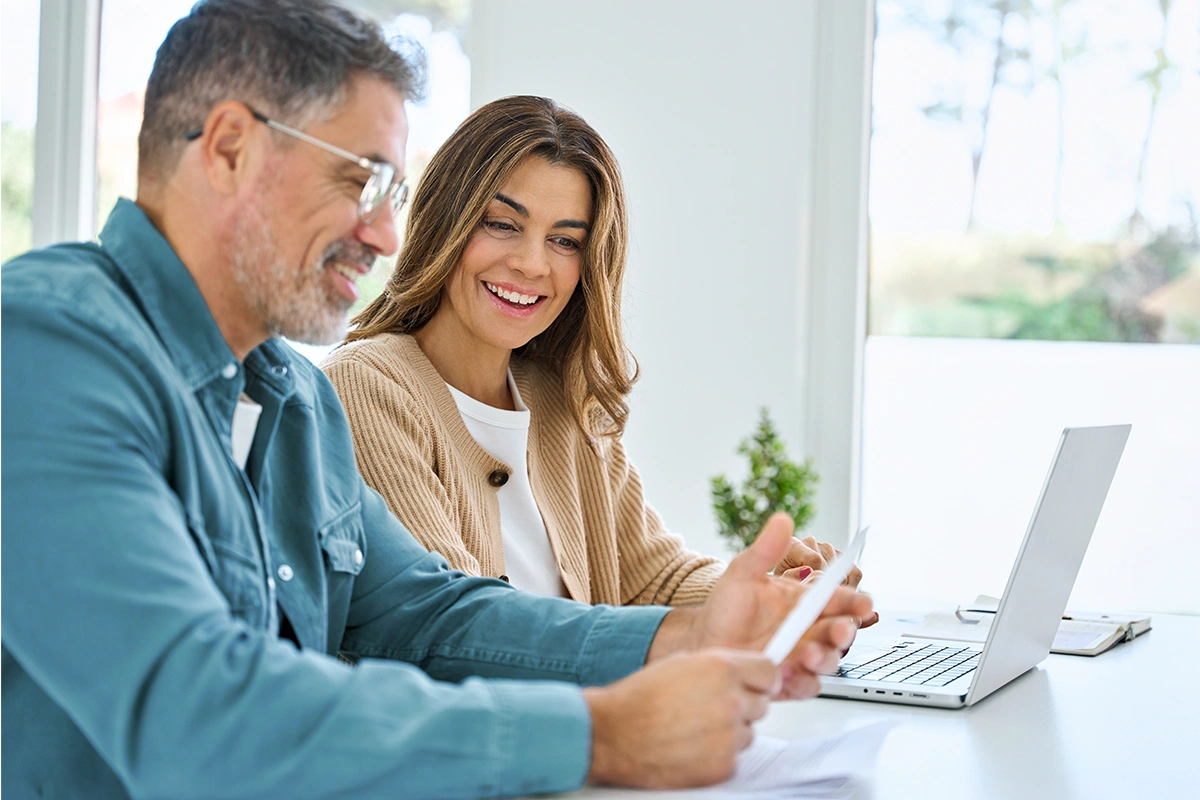 Couple reviewing updated tax numbers.