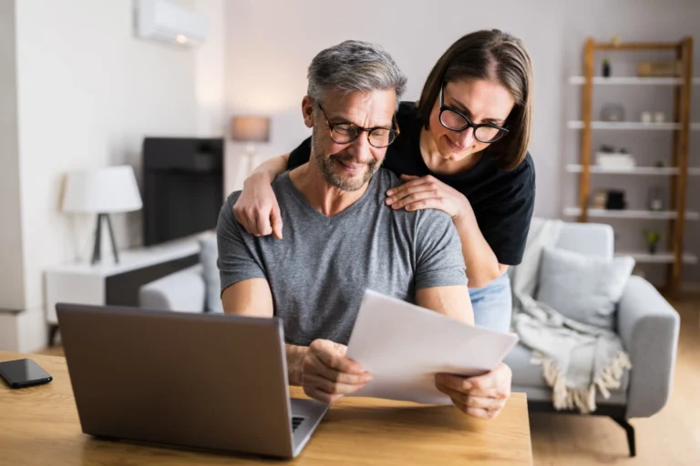 Married couple reviewing financial statements.