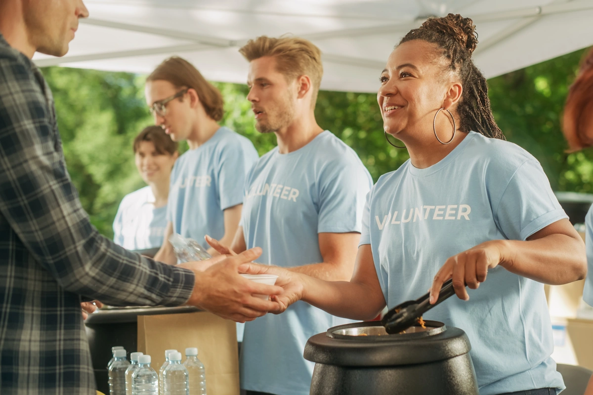 Volunteers handing out soup.