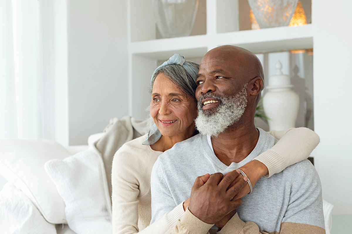 Mature African American couple embracing