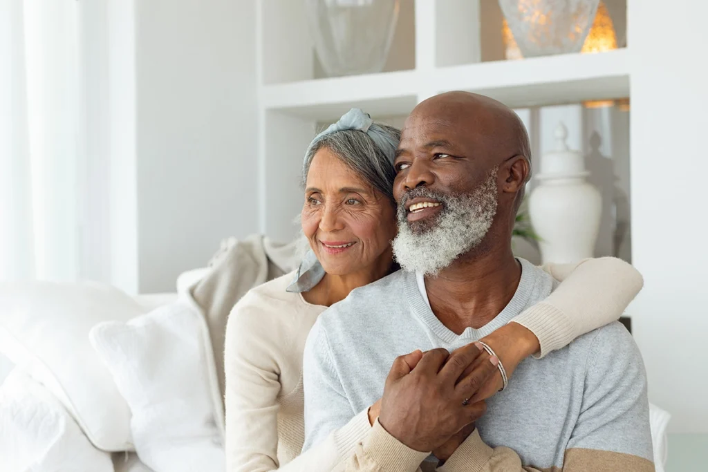Mature African American couple embracing