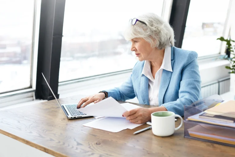 Senior woman working on laptop