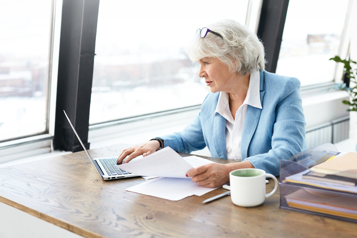 Senior woman working on laptop